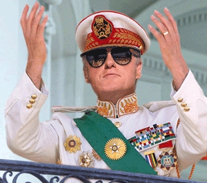Clinton greets his subjects from a White House balcony.